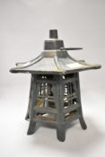 A modern cast metal Pagoda styled lamp or tea light holder.