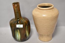 Two pieces of vintage studio pottery including indented vase with mottled green and brown glaze.