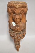 20th century oak carved wall sconce or bracket having classical design