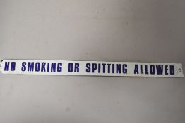 A vintage enamel sign ' No smoking or spitting allowed' .
