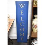 20th century metal framed retail sign reading Welcome