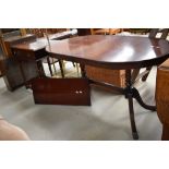 A 20th century reproduction Regency style mahogany extending dining table
