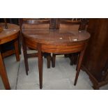 A Victorian Demi Lune fold over tea table in mahogany on fluted legs, with inlaid decoration to
