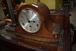 A mid 20th Century oak napoleon mantel clock