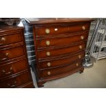 A reproduction bow fronted chest of five long drawers, in the Regency style, width approx. 80cm