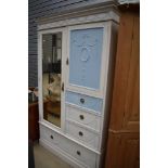 A 20th century painted pine shabby chic style wardrobe and drawer unit in a French style