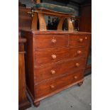 A badly varnished chest of pine drawers having beaded fronts with turned handles