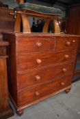 A badly varnished chest of pine drawers having beaded fronts with turned handles