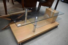 A 20th century modern laminate and glass coffee table