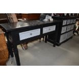 A 20th century storage chest and matching desk painted black and gray