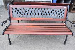 A 20th century garden bench having cast ends and back support