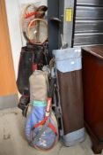 A selection of vintage golf clubs, tennis rackets etc