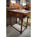 A good quality 20th century reproduction oak side table with drawer