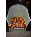 A 20th century woven fibre tub chair
