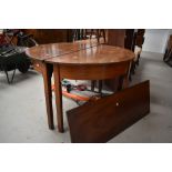 A 19th Century mahogany D end double demi lune dining table, with centre leaf
