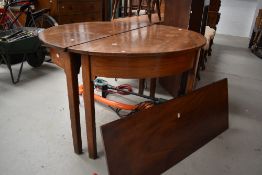 A 19th Century mahogany D end double demi lune dining table, with centre leaf