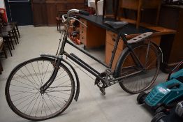 A vintage Holco cycles push bike.