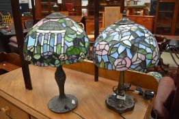 A matched pair of 20th century leaded light table lamps with metal bases