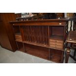 A Victorian mahogany dresser back or shop fitting with segmented centre section, drawers to sides