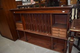 A Victorian mahogany dresser back or shop fitting with segmented centre section, drawers to sides