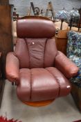 A brown leather Stressless style chair, chinese marks to adjuster