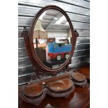 A Victorian dressing table or large bathroom mirror having scroll work mahogany frame with three