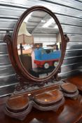 A Victorian dressing table or large bathroom mirror having scroll work mahogany frame with three
