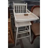 A vintage child's high/low chair, painted