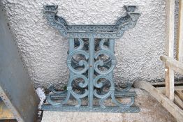 A pair of 20th century cast iron garden table legs or ends