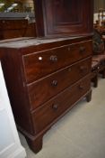 A Victorian chest of three drawers having turned handles