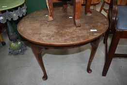 An early 20th Century mahogany coffee table having cabriole legs