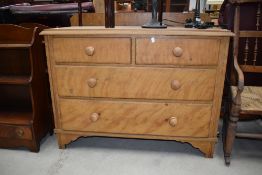 A Victorian chest of two over two drawers having scumbled finish with original turned handles