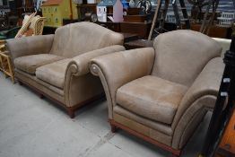 A tan leather settee and armchair