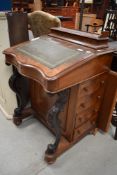 A Victorian Davenport having burr wood case with carved supports and side storage drawers