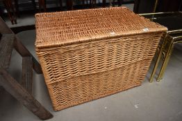 A 20th century large wicker woven basket or laundry hamper