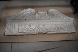 A late Georgian early Victorian architectural door cornice having scroll work design with laurel