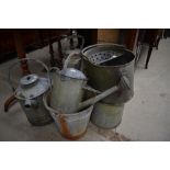 A collection of vintage metal ware to include watering cans, mop bucket, bucket and similar.