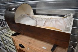 A 20th century ply crib with hood