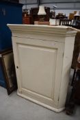 A Victorian corner cupboard painted pine or similar