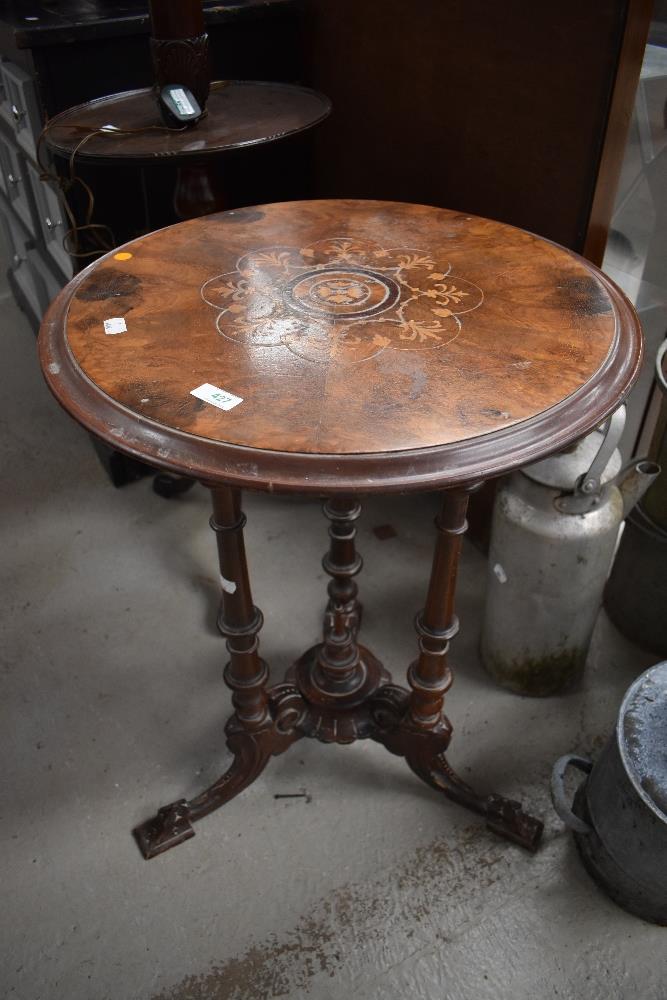 A Victorian side or wine table having turned and carved tripod base with...