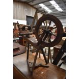 A Late Victorian oak framed spinning wheel having turned frame