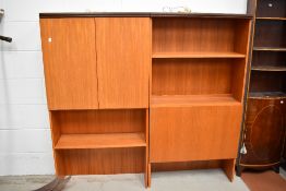 A pair of mid century two G Plan wall shelf units