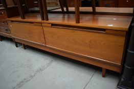 A mid century teak sideboard Long John having two large under drawers