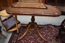 A Rossmore or similar oval dining table