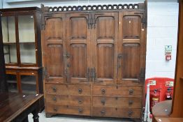 A 20th century hall way Refectory cupboard ecclesiastical Victorian Gothic style with double