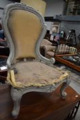 A 20th century carved boudoir chair frame
