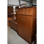 A mid century G Plan bedroom chest of three drawers and matching low wardrobe