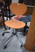 A modern laminate beech wood office chair