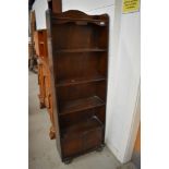 An early 20th century book case with under storage