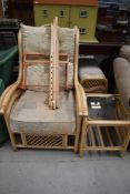 A cane work conservatory chair and footstool, and side table